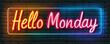 © Pornphan - Colorful neon sign saying Hello Monday on brick wall, bright and inviting