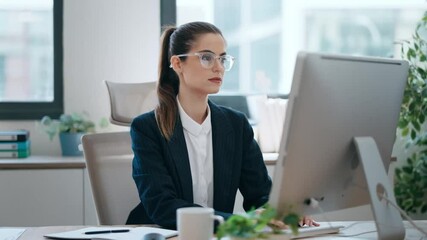 Wall Mural - Video of concentrated beautiful business woman working with computer at the office