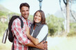 © peopleimages.com - Hug, portrait or happy couple in nature for hiking, adventure or travel journey on break in woods. Love, smile or people in forest to relax together for holiday vacation or trekking to explore park