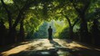 © Prapan - A contemplative silhouette of a standing Buddha, framed by lush green trees in a peaceful garden.