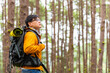 © CandyRetriever  - Asian man backpacker hiking in forest mountain in autumn. Healthy man traveler enjoy adventure outdoor active lifestyle hiking on nature trail forest dirt road on holiday vacation. Ecotourism concept.