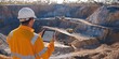 © Maftuh - Civil engineers use tablets to control mining sites. ensure control of field work runs smoothly