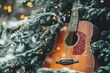 © Kim - rustic acoustic guitar rests against snow covered pine tree with twinkling lights, evoking sense of cozy winter peace