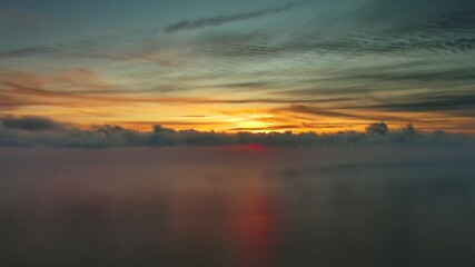 Wall Mural - aerial view of sea surface during a beautiful colourful sunset, timelapse, 4k