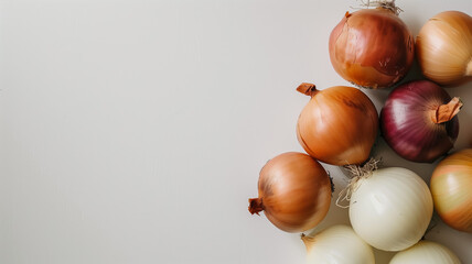 Wall Mural - Assortment of colorful onions on white background