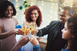 © peopleimages.com - Happy, group and friends with champagne toast of social reunion, event success and New Years celebration. People, cheers and alcohol drink for congratulations, gathering bonding and party achievement