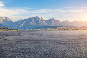 Wall Mural - Asphalt road square and mountain natural landscape at sunset. car background.