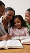 © Pixel Matrix - Family Bible study session unites African-American adults and children through shared Christian teachings