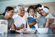 © peopleimages.com - Happy family, help or kids in kitchen for baking, encouragement or making cookies for Thanksgiving. Grandma, parents or children at home with development, bonding or mix ingredients for secret recipe