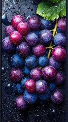 Poster - A cluster of vibrant grapes resting on a dark surface, enhanced by droplets of water, showcasing their freshness and color