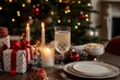 © JIALU - Beautifully decorated Christmas table with candles, gift boxes, red ribbon tree decoration, champagne glass, elegant cutlery, and a Christmas card with lights in the background.