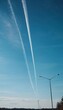 © Julija - Chemtrail conspiracy theory. Long-lasting condensation trails left in sky by high-flying aircraft are actually chemtrails consisting of chemical or biological agents, sprayed for nefarious purposes.