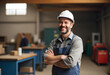 © StockLab - Happy middle aged man working in uniform inside of the small business factory with PPE safety plastic equipment