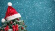 © Phatharaporn - Christmas Tree with Santa Hat and Snow