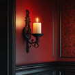 © Chanyapat - wall sconce with large candle illuminates rich red wall, creating warm and inviting atmosphere. intricate design adds elegance to space