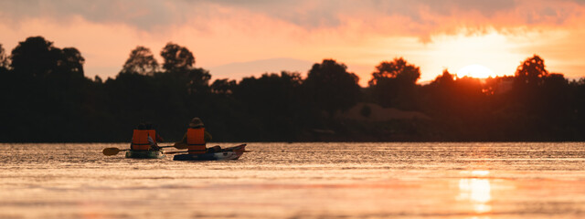 Wall Mural - beautiful landscape sunset, stunning view of the river and lake with orange and blue hues sky, trees