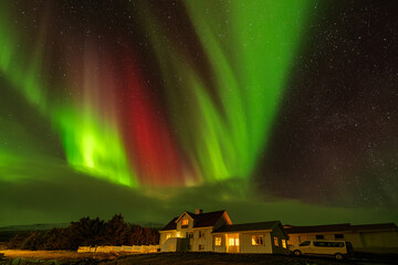 colorful aurora or northern light over the northen mountain in the night