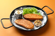 © New Africa - Tasty cooked sweet potato served in baking dish on orange table