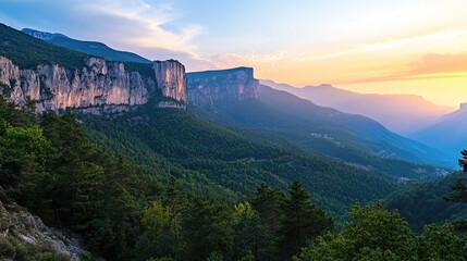 Poster - A serene mountain range landscape during sunset with warm colors and misty atmosphere