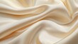 © Espresso - Soft, elegant cream satin fabric drapes in gentle folds, perfect for luxurious apparel or interior design.