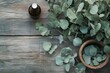 © LimeSky - Eucalyptus foliage and mortar on wood Spa idea Alternative medicine and natural cosmetic ingredients Essential oil bottle with eucalyptus bundle Organic skincare