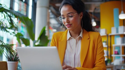 Poster - Woman Analyst Reviewing Data on Laptop in Modern Office