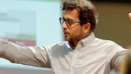 Fototapete - This teacher conducts a lesson standing in front of a projector, presenting a presentation.