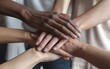 © StreamPixel - Close-up of a group of people holding hands symbolizing love, unity, and support in a team or family setting