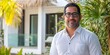 © J. Grayscale - Confident Professional Man Posing in Tropical Outdoor Setting