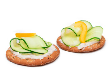 Wall Mural - Crispy Cracker Sandwich with Fresh Cucumber, Yellow Paprika and Cottage Cheese - Isolated on White. Easy Breakfast. Quick and Healthy Sandwiches. Crispbread with Tasty Filling. Healthy Dietary Snack