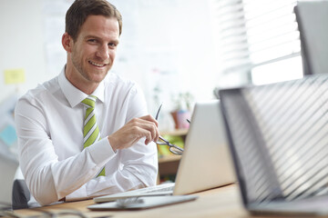Poster - Happy, office and portrait of businessman with glasses for confidence, company pride and smile. Professional, corporate and person with laptop for planning, research proposal and project review
