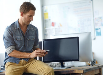 Poster - Creative, office and man with smartphone, online chat and search for web business connection at digital agency. Typing, phone and graphic designer at desk on mobile app for networking at tech startup