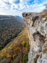 Poster - Majestic cliff overlooking a vibrant autumn forest and expansive valley, AI