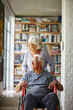 © peopleimages.com - Old couple, view and helping man in wheelchair, home and support husband with injury. Senior people, assistance and person with disability, healthcare and kindness in rehabilitation or compassion
