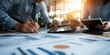 © WD Stock Photos - A team of people leaning over a conference table and reviewing a project