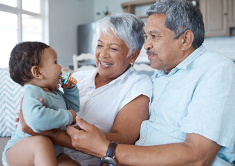 Wall Mural - Smile, love and grandparents with baby on sofa for bonding, laughing and support. Relax, happiness and generations with senior man and woman holding child in living room of family home together