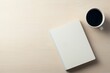 © AImagine Designs - Minimalist flat lay with closed notebook and coffee cup on light wooden surface