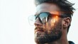 © familymedia - A close-up profile of a man with a beard wearing sunglasses, overlaid with skyscrapers reflecting a setting sun, creating a blend of human and urban elements.