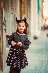 Wall Mural - halloween portrait of a child in a dress