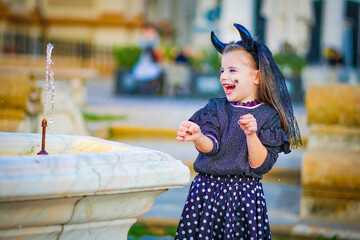 Wall Mural - halloween portrait of a child in a dress