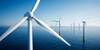 © LakenDesign - A series of wind turbines in the ocean harnessing renewable energy.