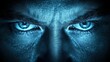 © imagineRbc - A man with blue eyes staring at the camera. The eyes are open and the man's face is illuminated by a blue light