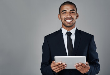Poster - Happy, portrait or businessman with tablet for investment, profit or online finance on a gray background. Man, broker or investor with smile or technology for trading app or financial growth on space
