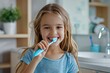 © Aleksandr - Smiling Little Girl Brushing Her Teeth with a Toothbrush. Dental Hygiene for Children.