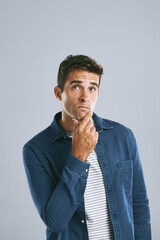Aufkleber - Handsome man, thinking and fashion with decision for choice, pick or change in outfit on a studio background. Young, male person or casual model contemplating in wonder for good clothing idea