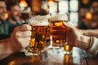 © Adobe Contributor - Friends toasting with beer mugs in a bar