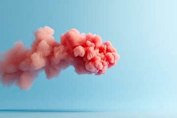 Wall Mural - Abstract pink cloud like shape in front of blue background