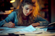 © ibooM - A woman engages with financial management documents.