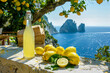 © alexandro900 - Una bottiglia di limoncello su un tavolo di pietra, circondato da limoni freschi, su una terrazza mediterranea con vista sui Faraglioni dell'isola di Capri, Italia