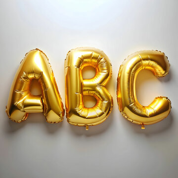 Gold foil balloons shaped as letters 